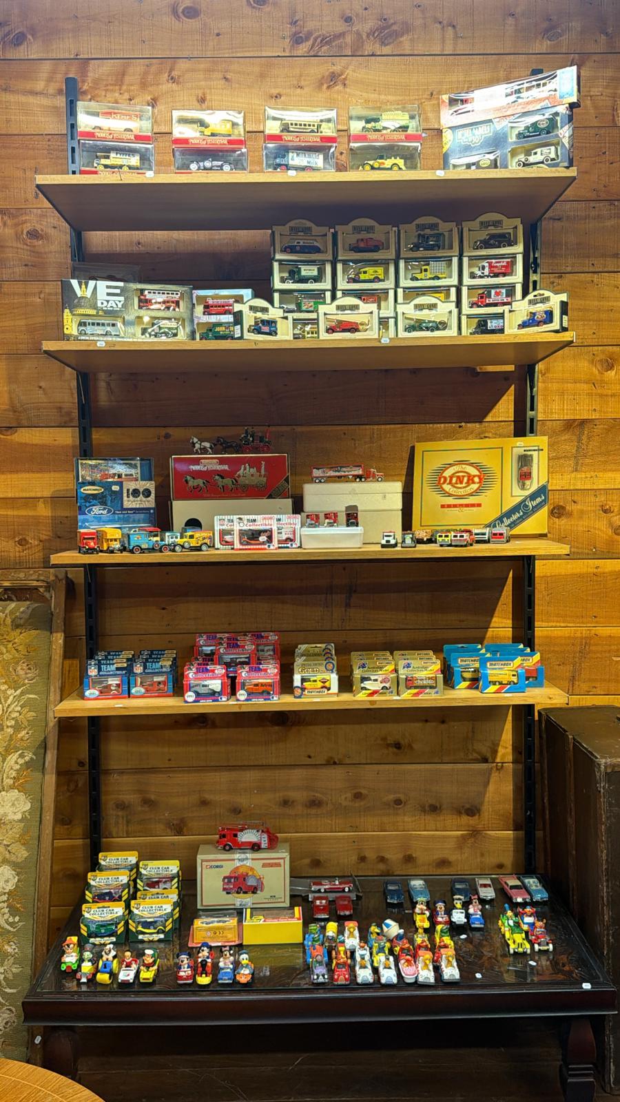 Fun-Ho and vintage toy vehicles on display shelves